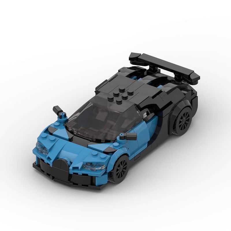 Blue and black LEGO sports car model with detailed headlights and rear spoiler on white background