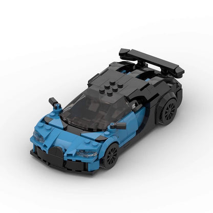 Blue and black LEGO sports car model with detailed headlights and rear spoiler on white background