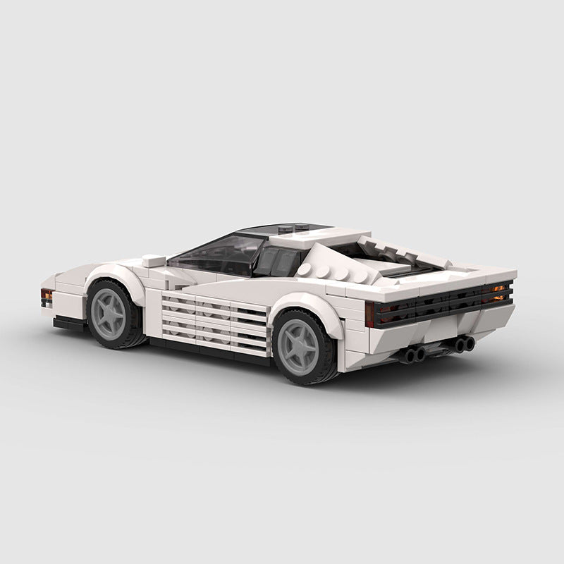 Red Ferrari Testarossa diecast model by RevvBlox showing detailed exterior and iconic side strakes.
