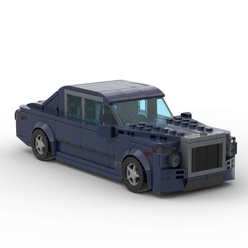 Dark blue LEGO model of a luxury sedan car with detailed front grille and transparent windows