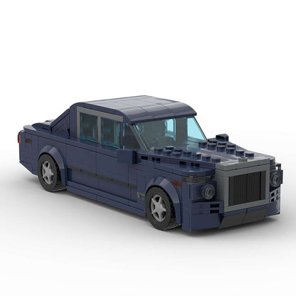 Dark blue LEGO model of a luxury sedan car with detailed front grille and transparent windows