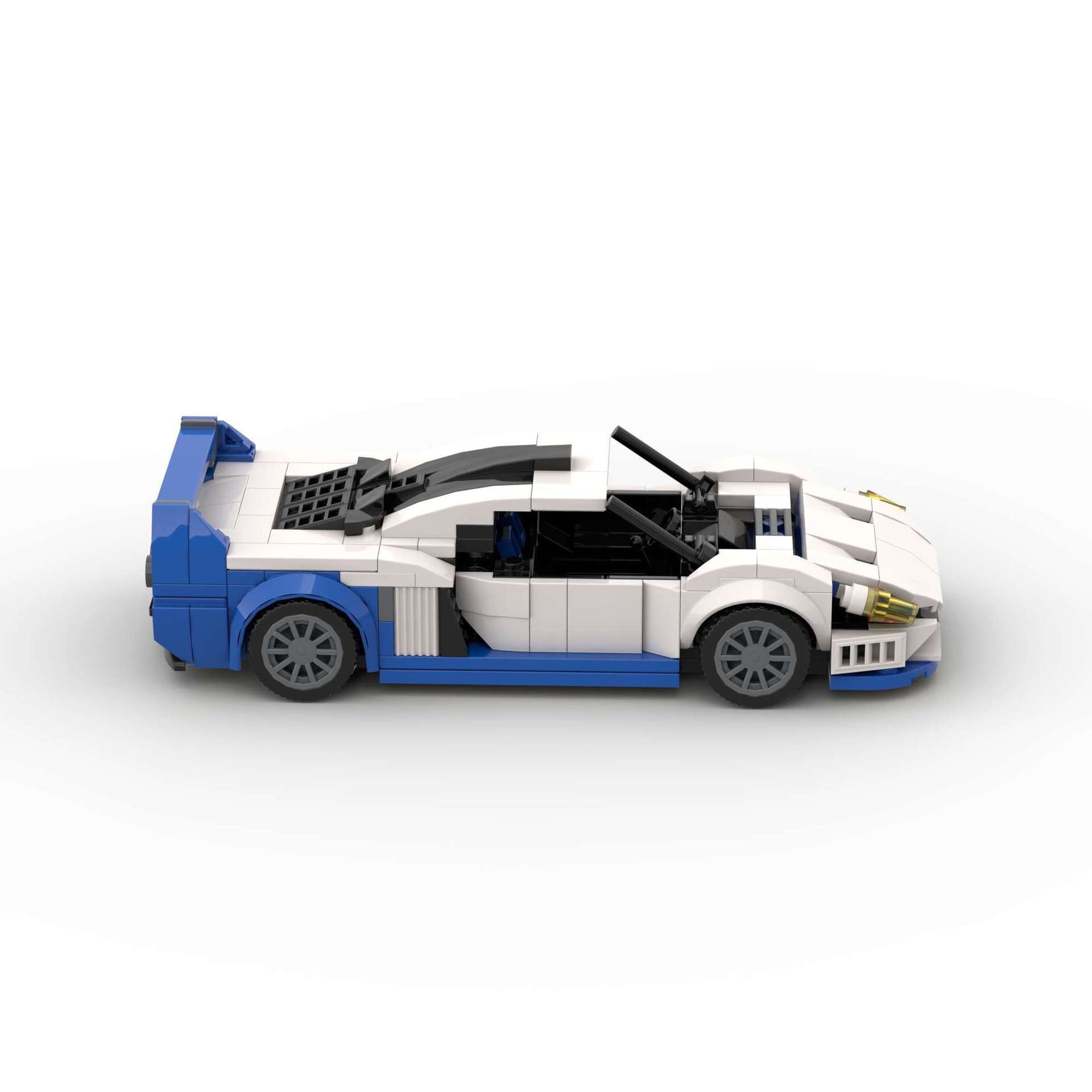 RevvBlox Maserati MC12 model car in detailed plastic construction with sleek silver and blue design.