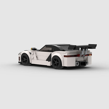 RevVBlox model of Mitsubishi GTO 3000GT sports car, detailed front view with sleek red and black design.
