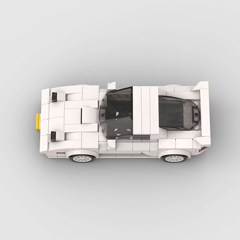 Red Mazda RX-7 FC3S model car by RevvBlox, detailed miniature with sleek design and distinctive sports car features.