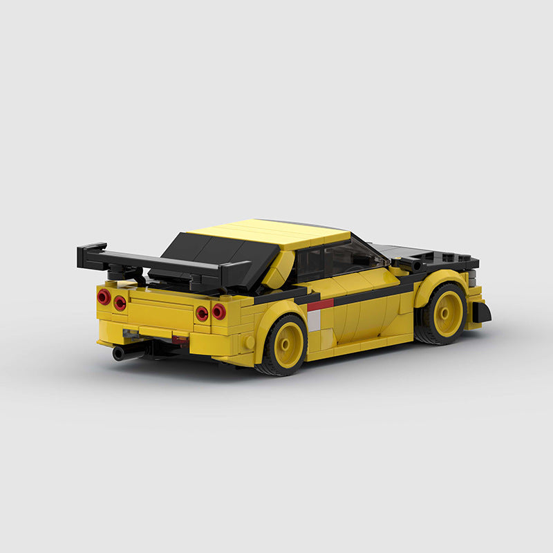 RevvBlox Nissan GT-R R34 model car in blue with detailed exterior and sporty design, showcasing the iconic Japanese sports car.