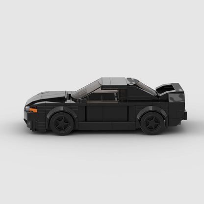 RevvedBlox Nissan Skyline GT-R R32 "Takeshi" Initial D model car with detailed blue and white paint, displayed on a plain background.