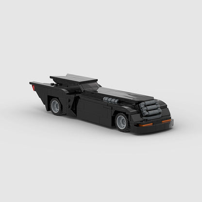 RevVblox Batmobile toy model with detailed black and gray design, sleek profile, and iconic Batmobile features.