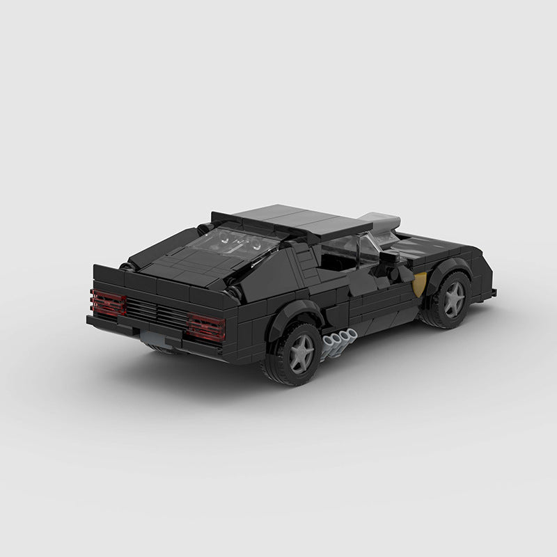 RevvBlox 1973 Ford Falcon Mad Max V8 Interceptor model car with detailed black and orange design, showcasing rugged vehicle features.