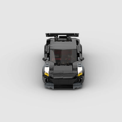RevvBlox Tesla Model 3 Bionic toy car with detailed exterior and realistic features, displayed on a white background.