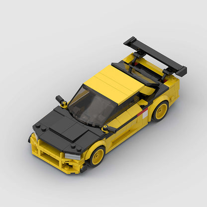RevVBlox Nissan GT-R R34 model car with detailed blue body and black wheels, showcasing realistic design and craftsmanship.