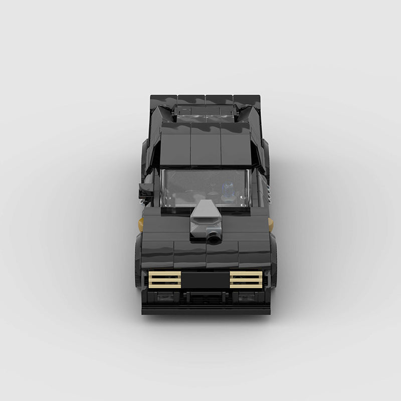RevvBlox 1973 Ford Falcon Mad Max V8 Interceptor die-cast model car with detailed black and orange design.