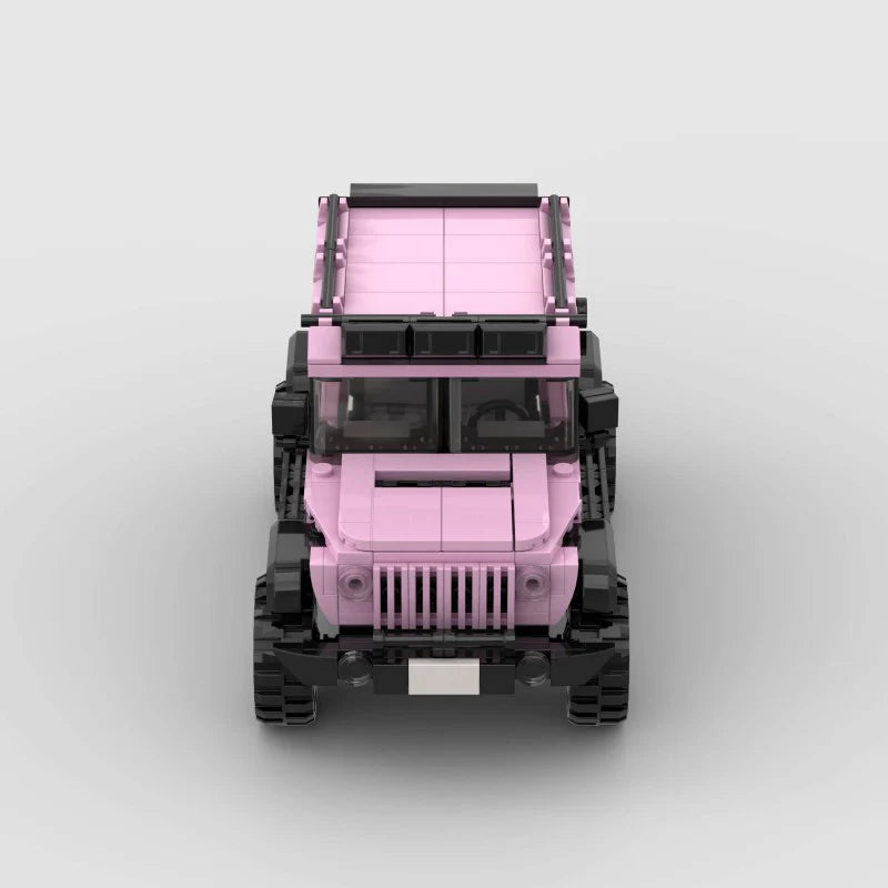 Pink edition Jeep Wrangler toy by RevvBlox with detailed pink plastic body, black wheels, and off-road design.