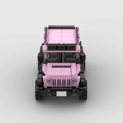 Pink edition Jeep Wrangler toy by RevvBlox with detailed pink plastic body, black wheels, and off-road design.