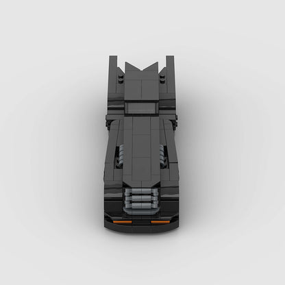 RevvBlox Batmobile toy model with detailed black and gray design, featuring sleek curves and Batmobile branding.