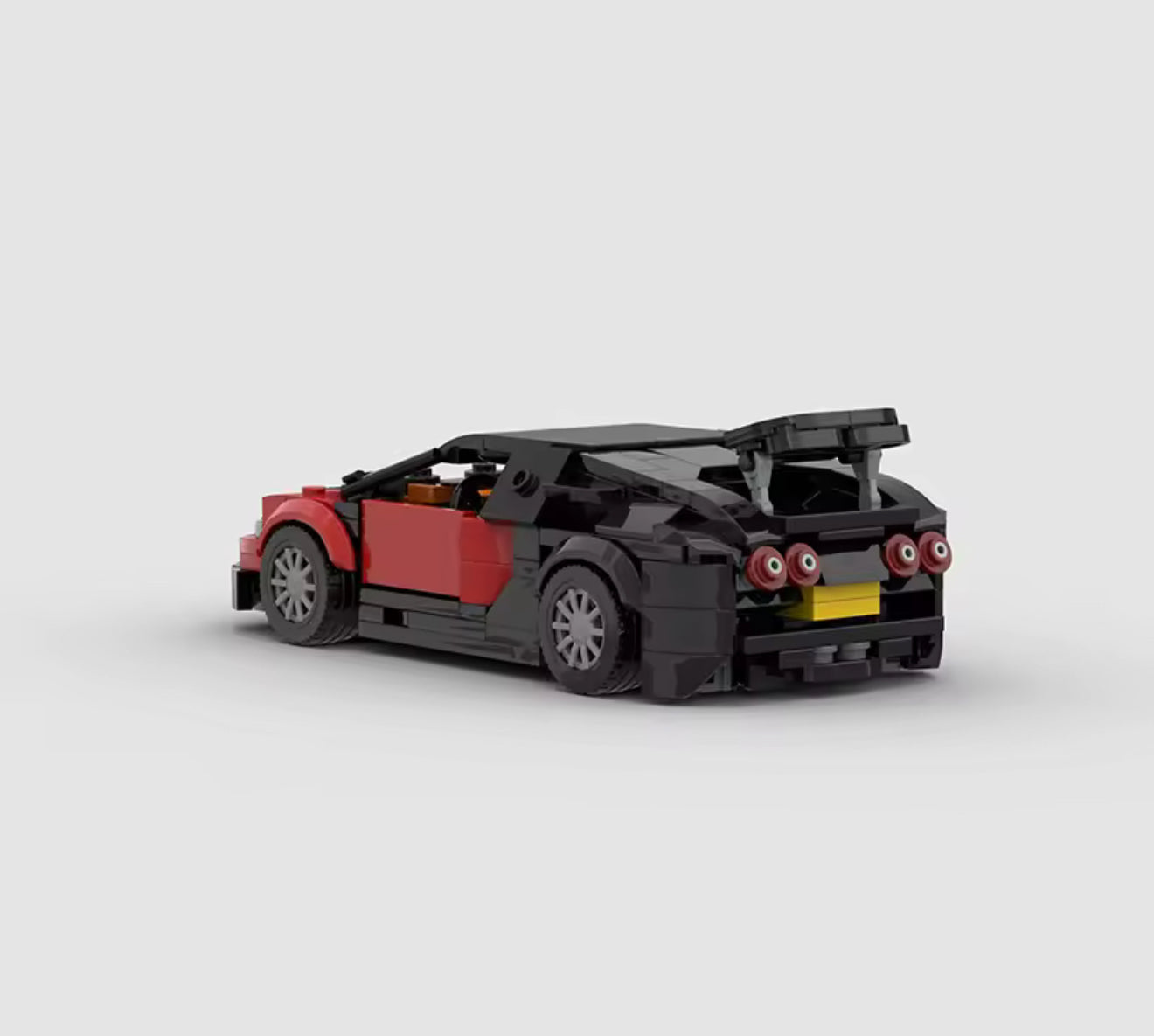 RevVBlox Bugatti Veyron model car in detailed plastic construction, showcasing sleek design and iconic sports car features.