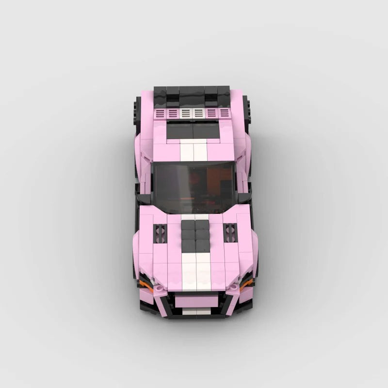 Pink Ford Mustang Shelby GT500 model car by RevvBlox, detailed with racing stripes and realistic design features.