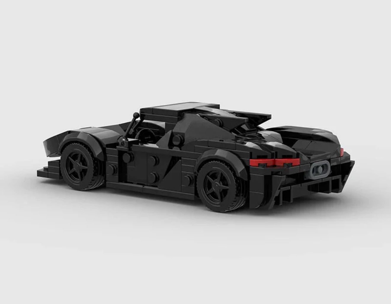 RevvBlox Koenigsegg Jesko model showcasing sleek design and detailed features in a dynamic pose.