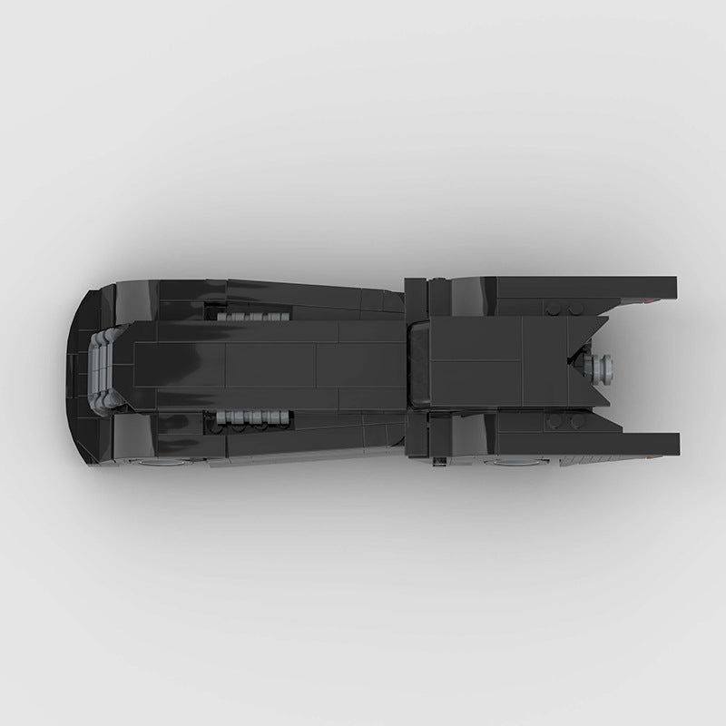 RevVBlox Batmobile toy model with detailed black and red design, featuring sleek, futuristic features and Batman-themed accents.