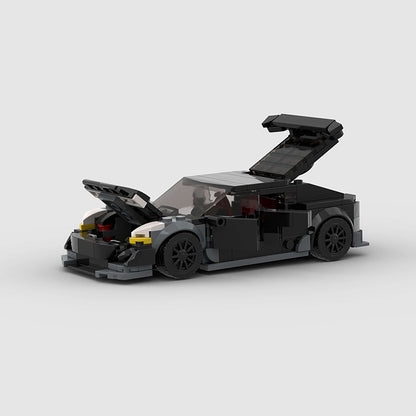 Tesla Model 3 Bionic by RevvBlox, detailed scale model with sleek design and realistic features, displayed on a clean background.