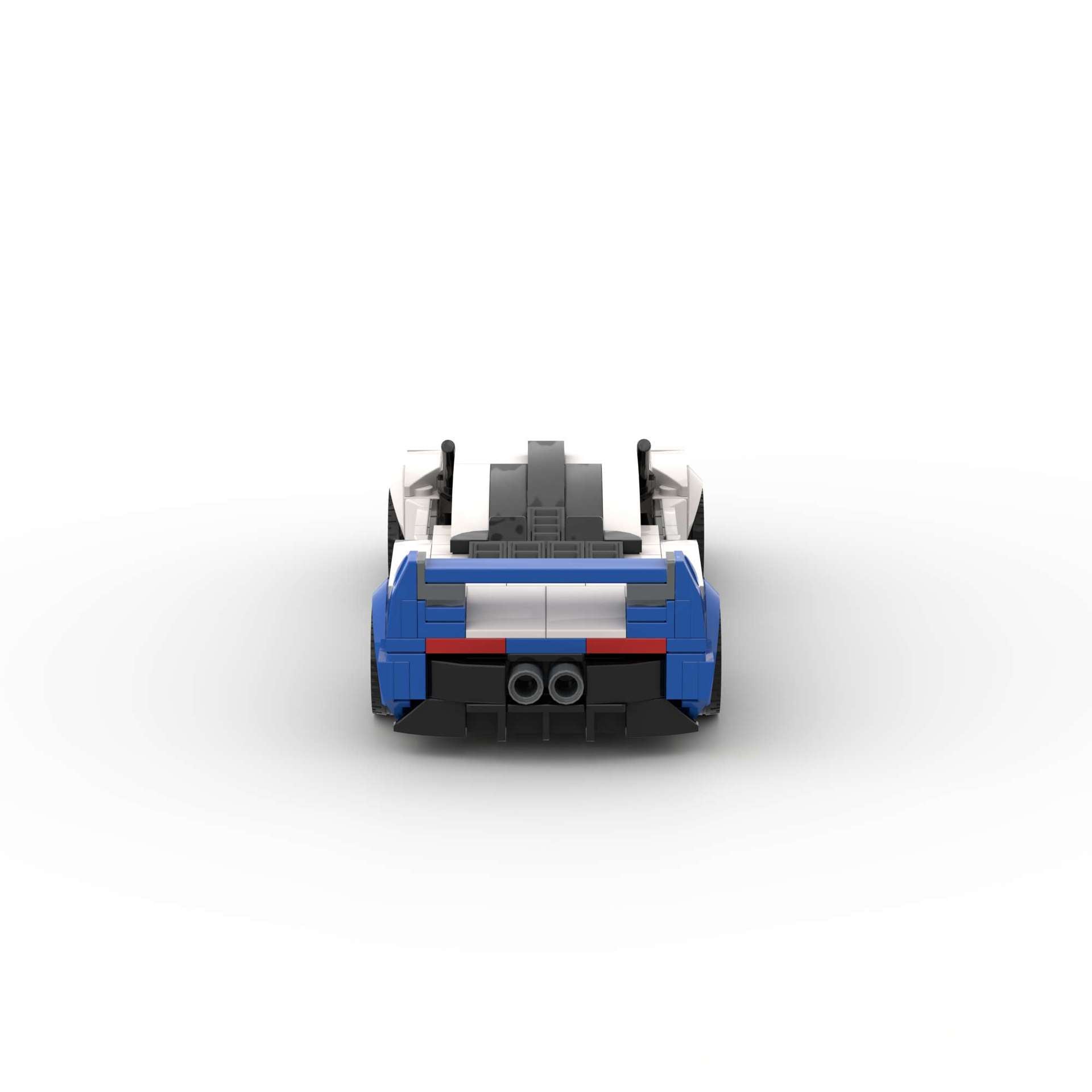 RevVBlox Maserati MC12 model car with detailed red and white design, showcasing aerodynamic curves and intricate features.