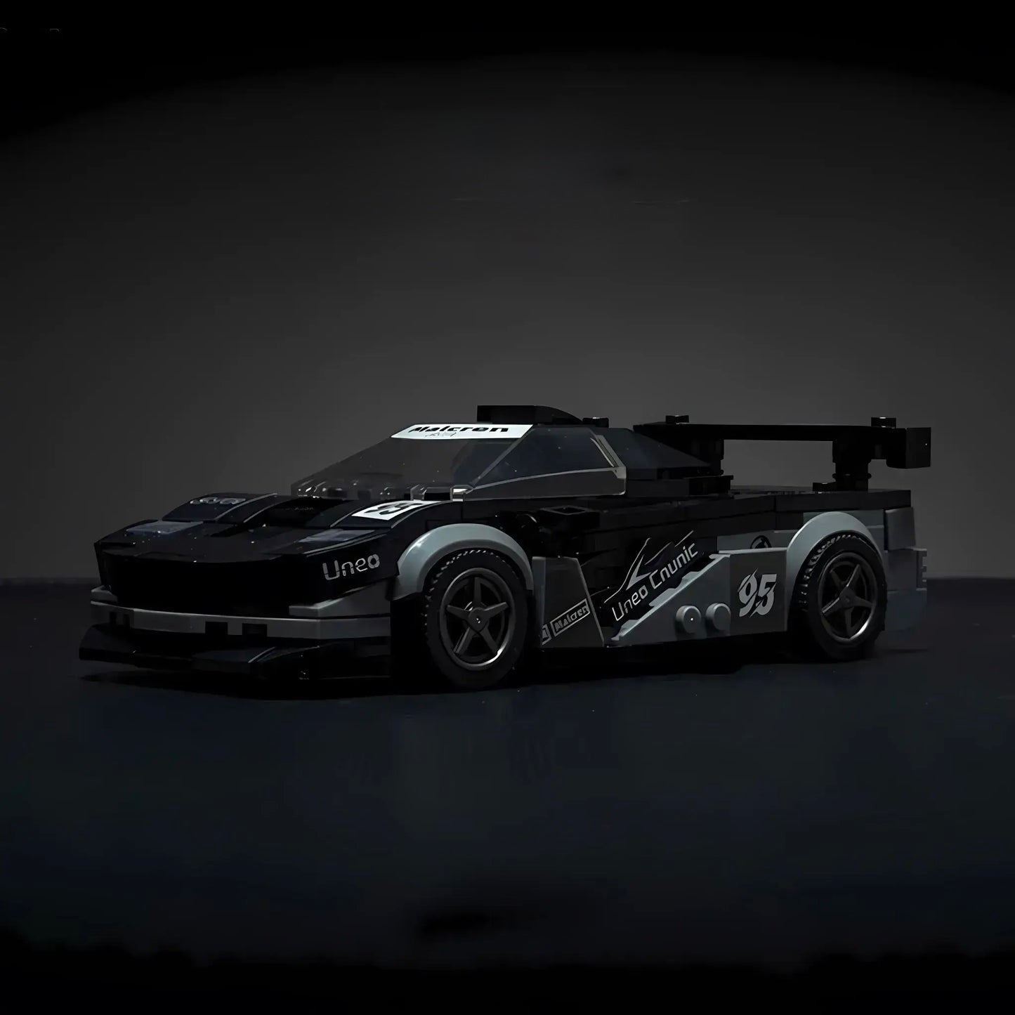 McLaren F1 model by RevvBlox showcasing sleek design and detailed racing features on a white background.
