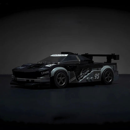 McLaren F1 model by RevvBlox showcasing sleek design and detailed racing features on a white background.