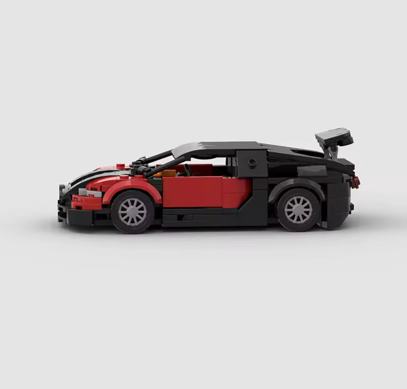 RevvBlox Bugatti Veyron model car with detailed blue and black design, showcasing sleek sports car features and intricate craftsmanship.