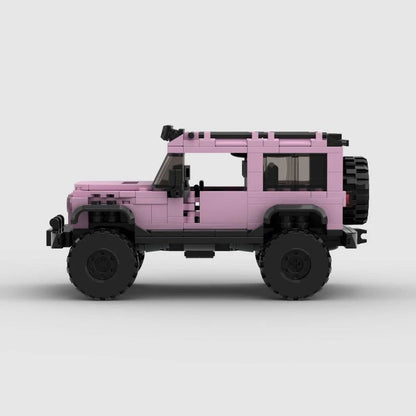 Pink edition RevvBlox Jeep Wrangler toy vehicle, detailed replica with realistic features and rugged design.