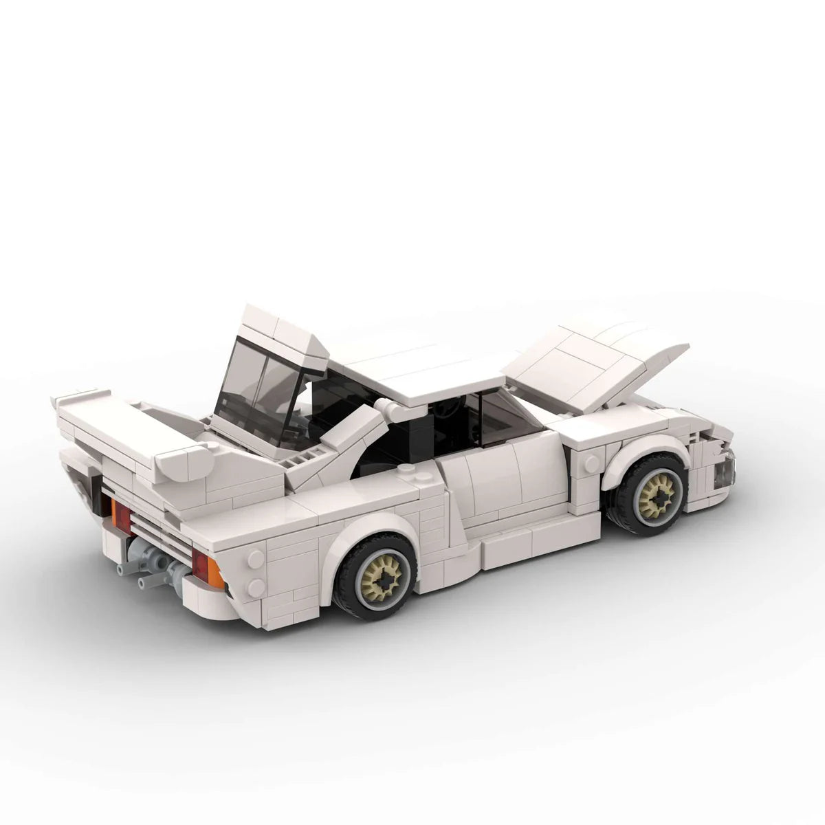 Revvblox Porsche 935 model car with detailed black and orange design, showcasing a sleek sports car replica.