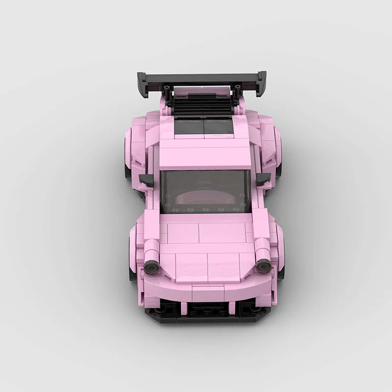 Pink edition Porsche 911 RWB model by RevvBlox, showcasing detailed exterior design and vibrant color.
