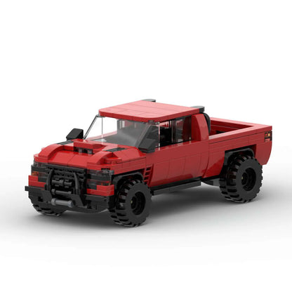 RevvBlox Dodge Ram model toy in gray with detailed truck features, front grille, and realistic design.
