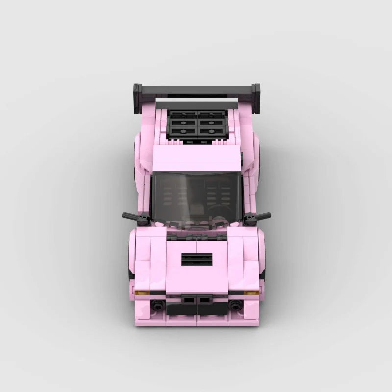 Pink BMW M1 RevvBlox model car, detailed scale replica with vibrant pink finish and realistic features.
