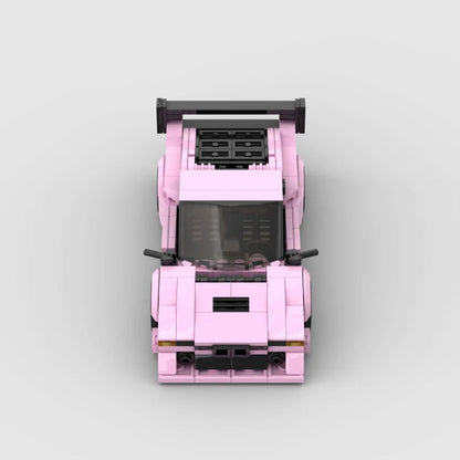 Pink BMW M1 RevvBlox model car, detailed scale replica with vibrant pink finish and realistic features.