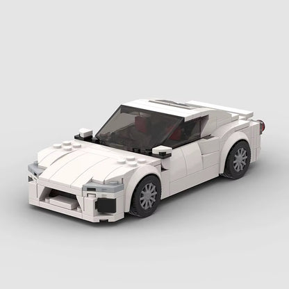 RevVBlox Toyota GT86 model car in red with detailed exterior and racing design on a white background.