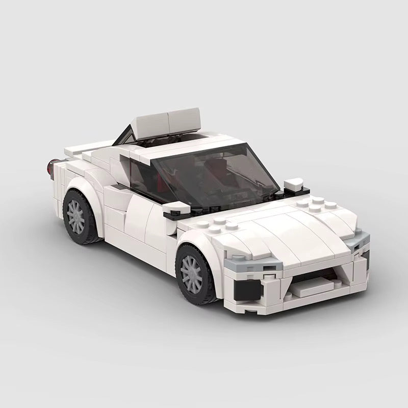 Red RevvBlox Toyota GT86 model car with detailed exterior and racing-inspired design, showcased on a plain background.
