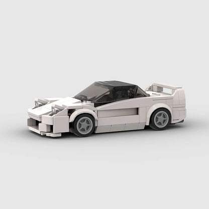 RevVBlox Honda NSX model car in vibrant orange with detailed exterior and sleek design, displayed on a clean background.