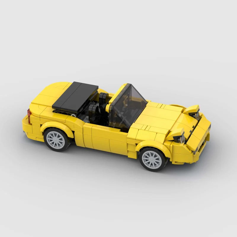 RevvBlox Mazda Miata MX-5 model car featuring detailed blue and white design, showcasing the scale replica's intricate features.