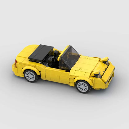 RevvBlox Mazda Miata MX-5 model car featuring detailed blue and white design, showcasing the scale replica's intricate features.