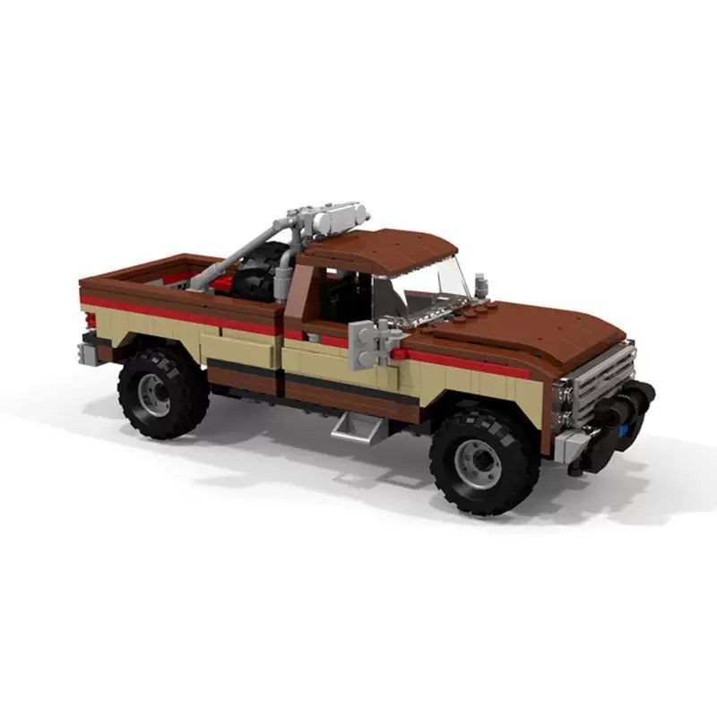 RevvBlox Fall Guy pickup truck toy with detailed red and white design, featuring realistic truck features and branding.