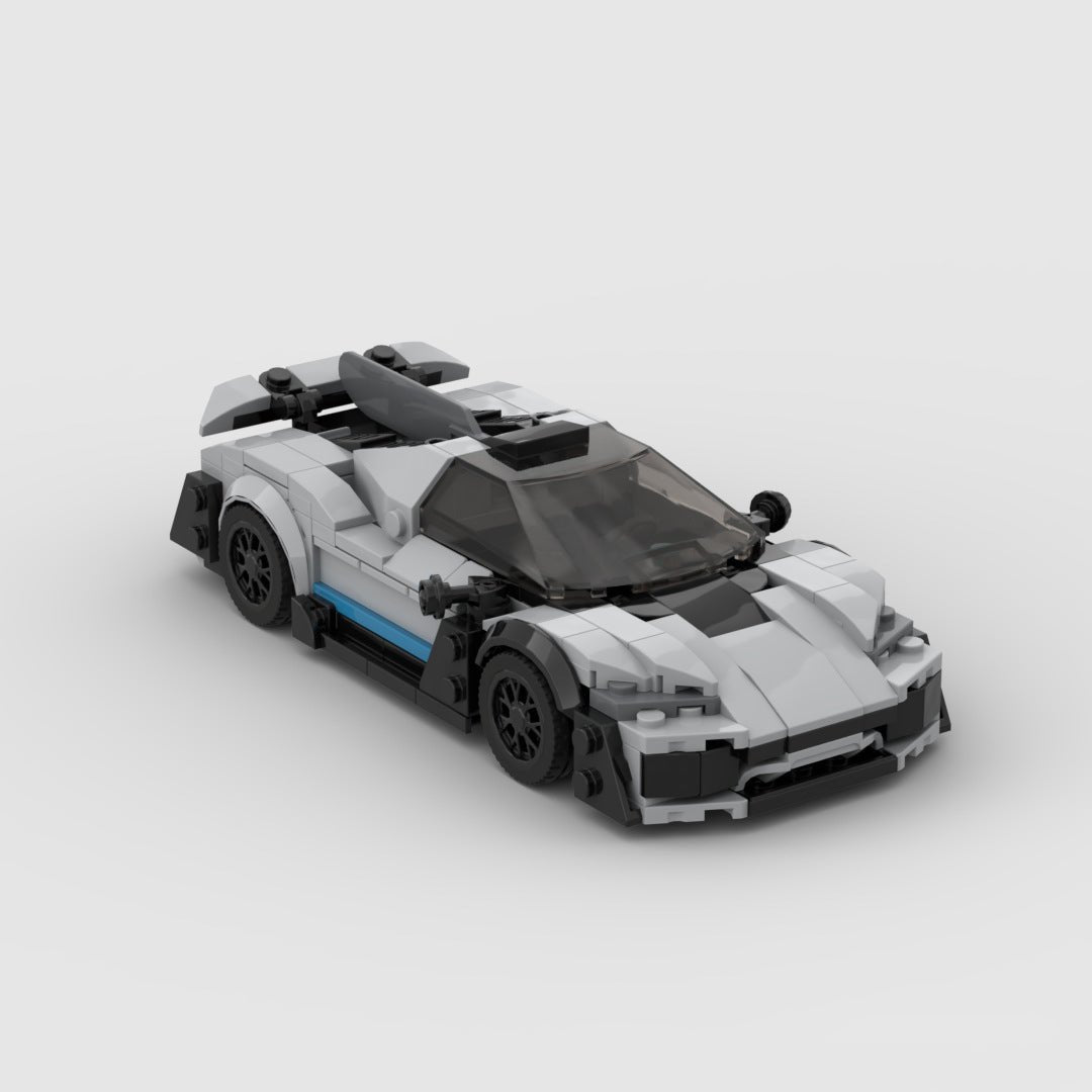White and black LEGO model of a Mercedes-Benz AMG One hypercar with tinted windshield and blue side stripe