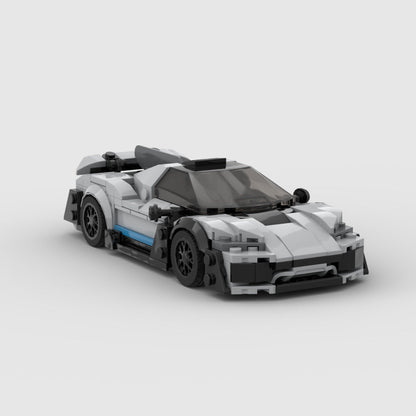 White and black LEGO model of a Mercedes AMG One hypercar with blue side detail