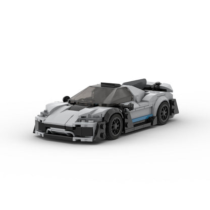 LEGO-style white and black sports car model with sleek design and tinted windshield on white background