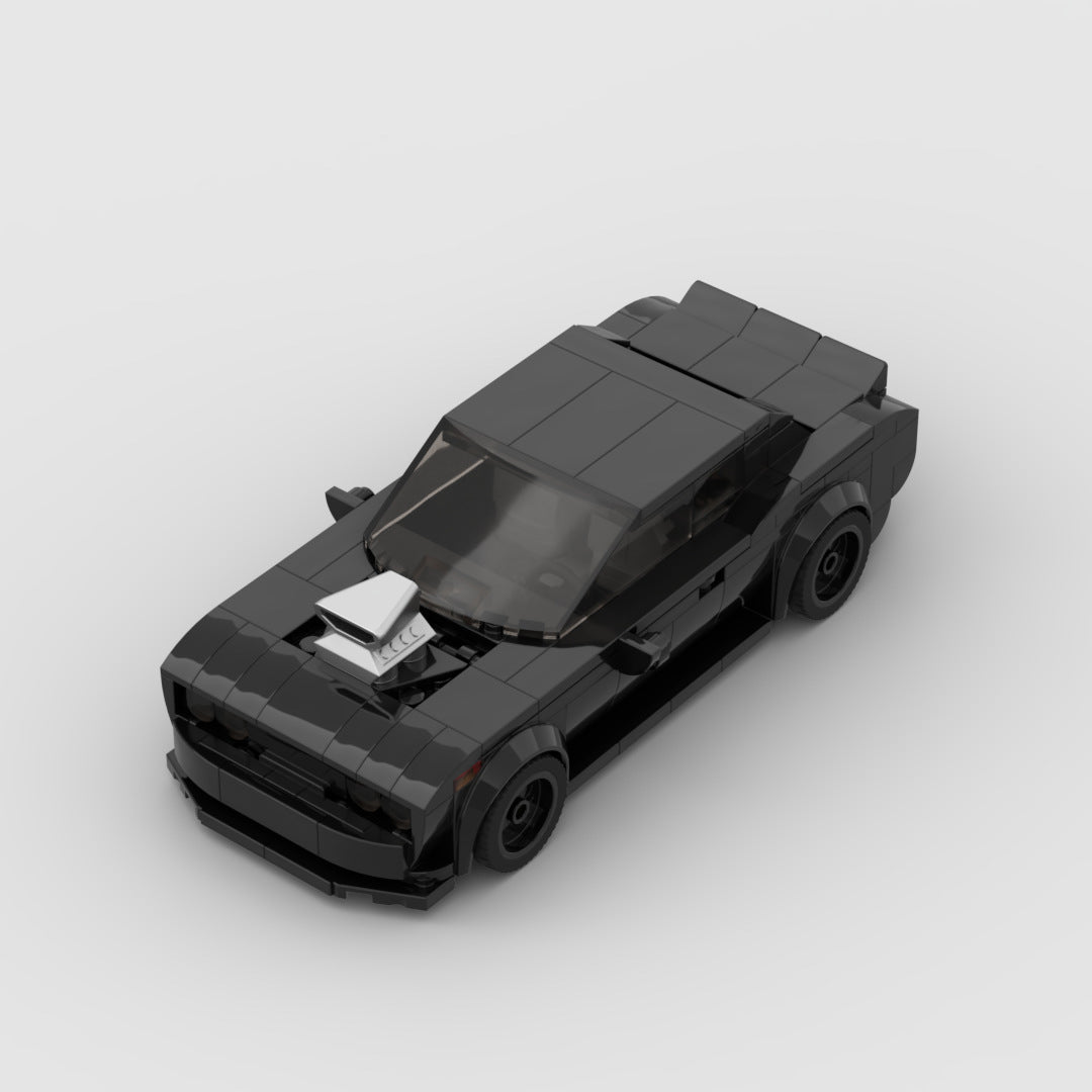 Black LEGO model of muscle car with blower hood scoop on a gray background