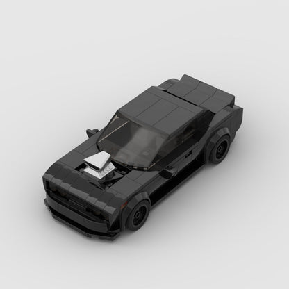 Black LEGO model of muscle car with blower hood scoop on a gray background