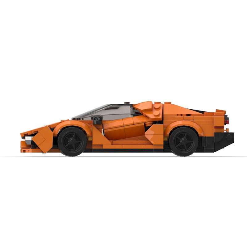 Orange LEGO model of a sleek sports car with black wheels on a white background