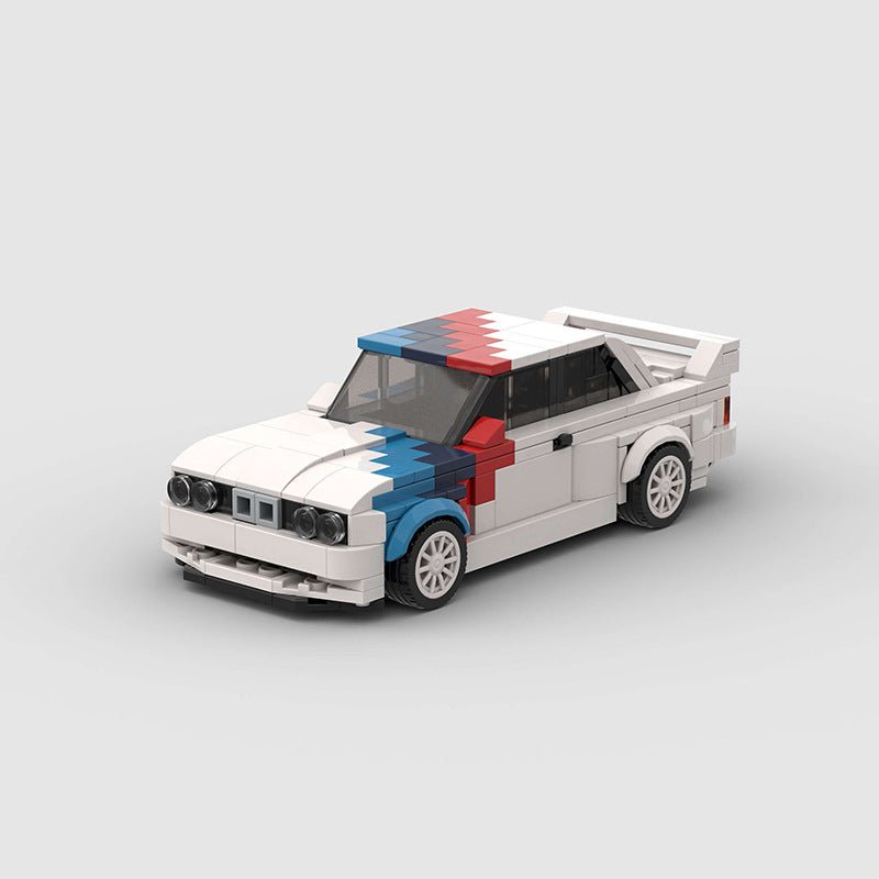LEGO model of a vintage race car with white, blue, and red color blocks on hood and roof, featuring rear spoiler