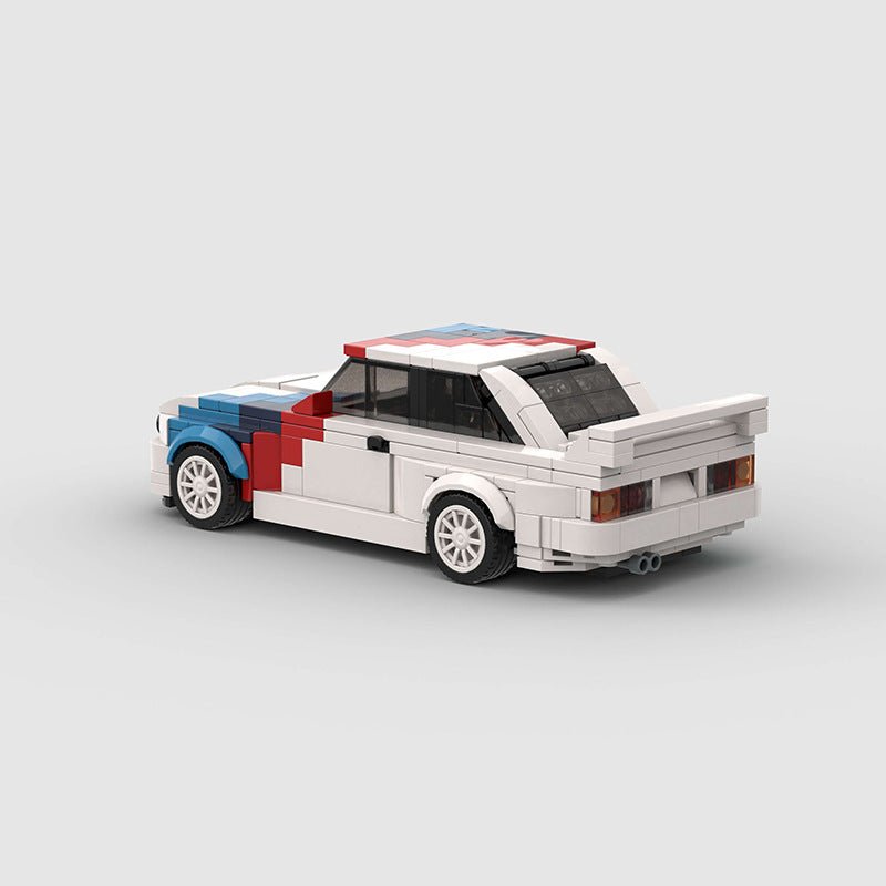 Rear side view of a white LEGO model car with red and blue racing stripes and a large rear spoiler
