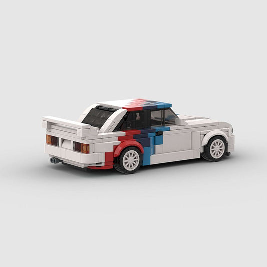 LEGO model of a white classic car with red and blue racing stripes on a gray background
