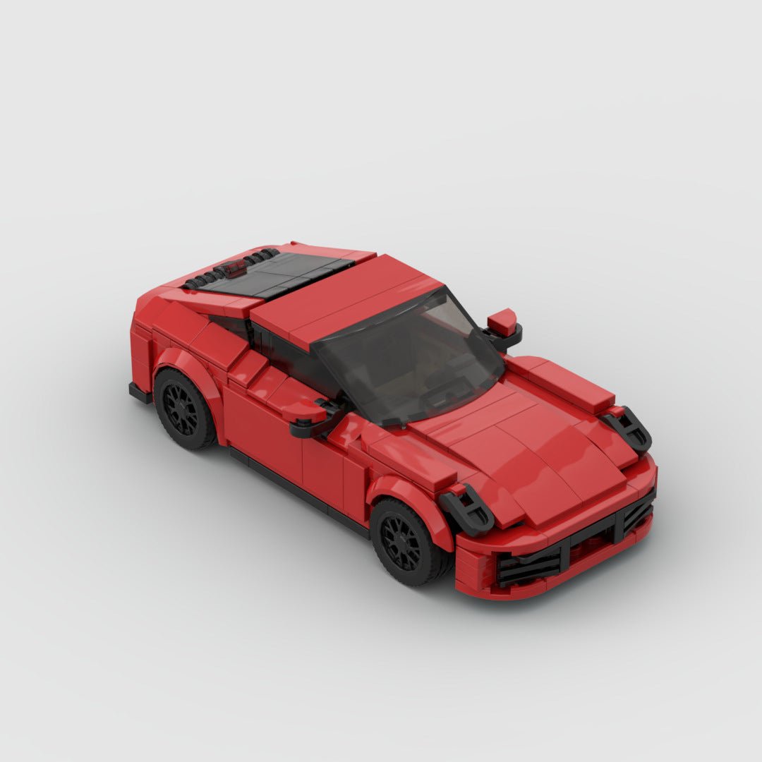 Red LEGO model of a sports car resembling Porsche 911 Carrera on white background