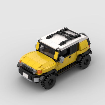 Yellow and white toy SUV model resembling Toyota FJ Cruiser with roof rack, off-road tires